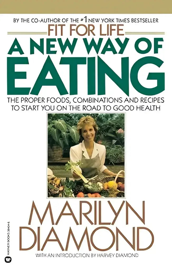 Een hardcover boek fit for life met een witte kaft en groene en bruine tekst over een nieuwe manier van eten