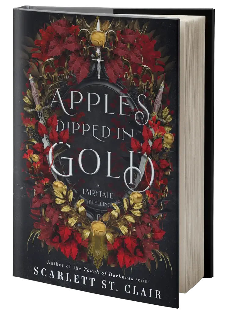 Hardcover boek apples dipped in gold met een donker omslag, rode poinsettia, gouden schedels en metalen ornamenten