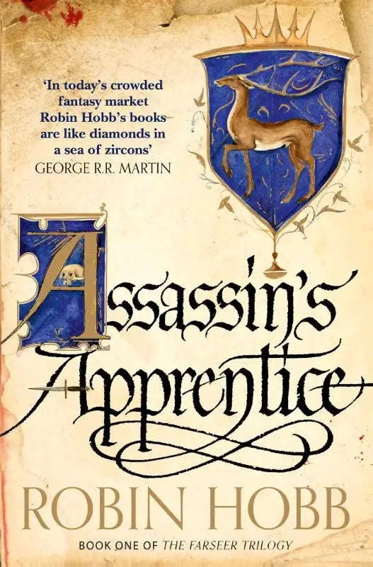 The cover of assassin’s apprentice by robin hobb features an ornate blue shield with a golden stag on aged parchment