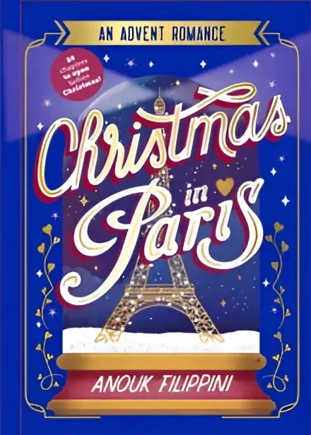 Blauw boek met de titel Christmas in Paris van Anouk Filippini met een witte eiffeltoren illustratie en gouden letters