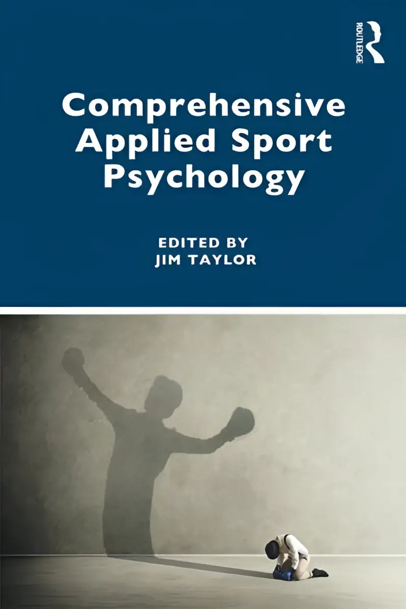 Blauw hardbackboek comprehensive applied sport psychology met minimalistisch ontwerp en contrasterende silhouetten