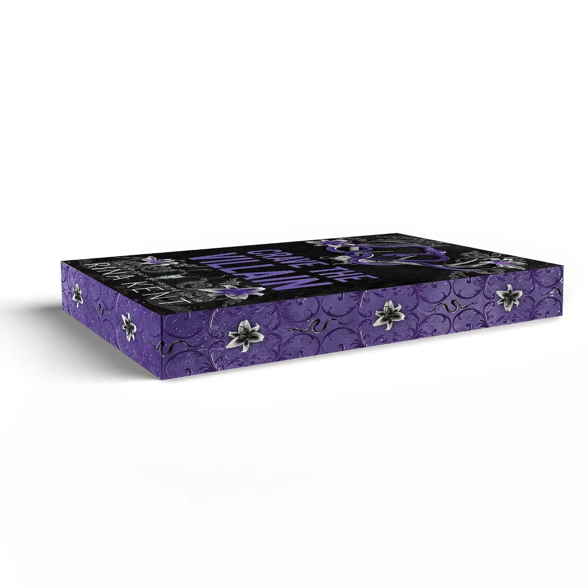 Paarse rechthoekige boekenbox met zwart bloemrijk patroon en witte lelies voor crave the villain special edition van rina kent