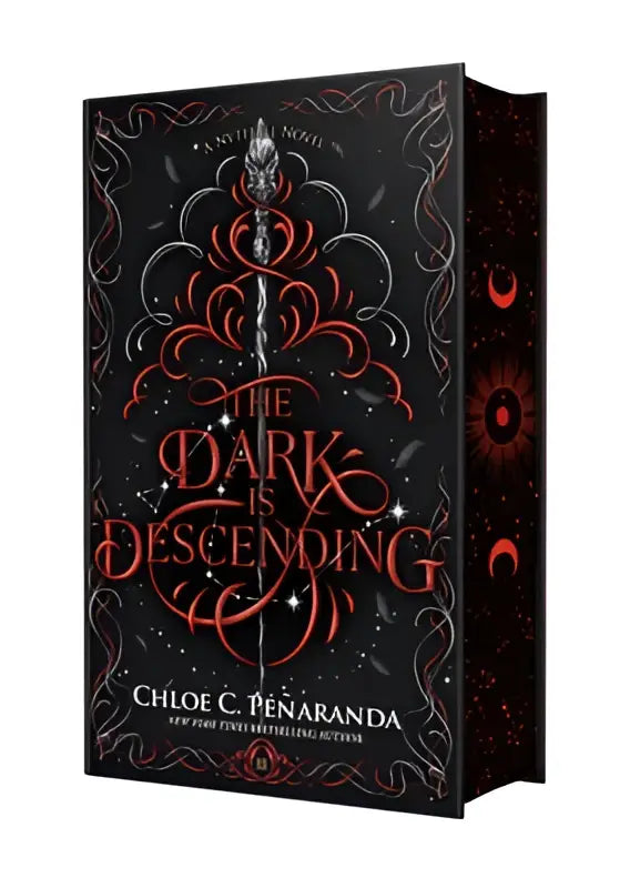 Black hardcover book with intricate red and silver designs titled the dark is descending by chloe c from the nytefall novel series
