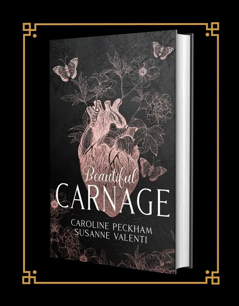 Zwarte hardcover boek beautiful carnage van caroline peckham met rosegouden anatomisch hart en bloemen in dark empire reeks
