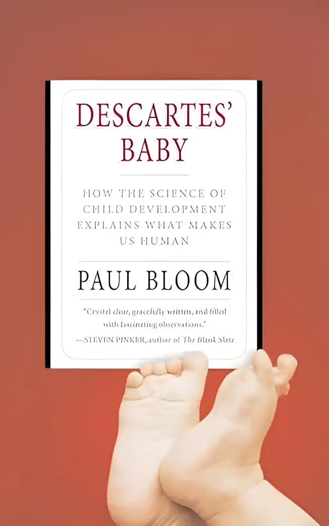 Een wit hardcoverboek getiteld Descartes baby door Paul Bloom met minimalistisch ontwerp en kleine voetafdrukken