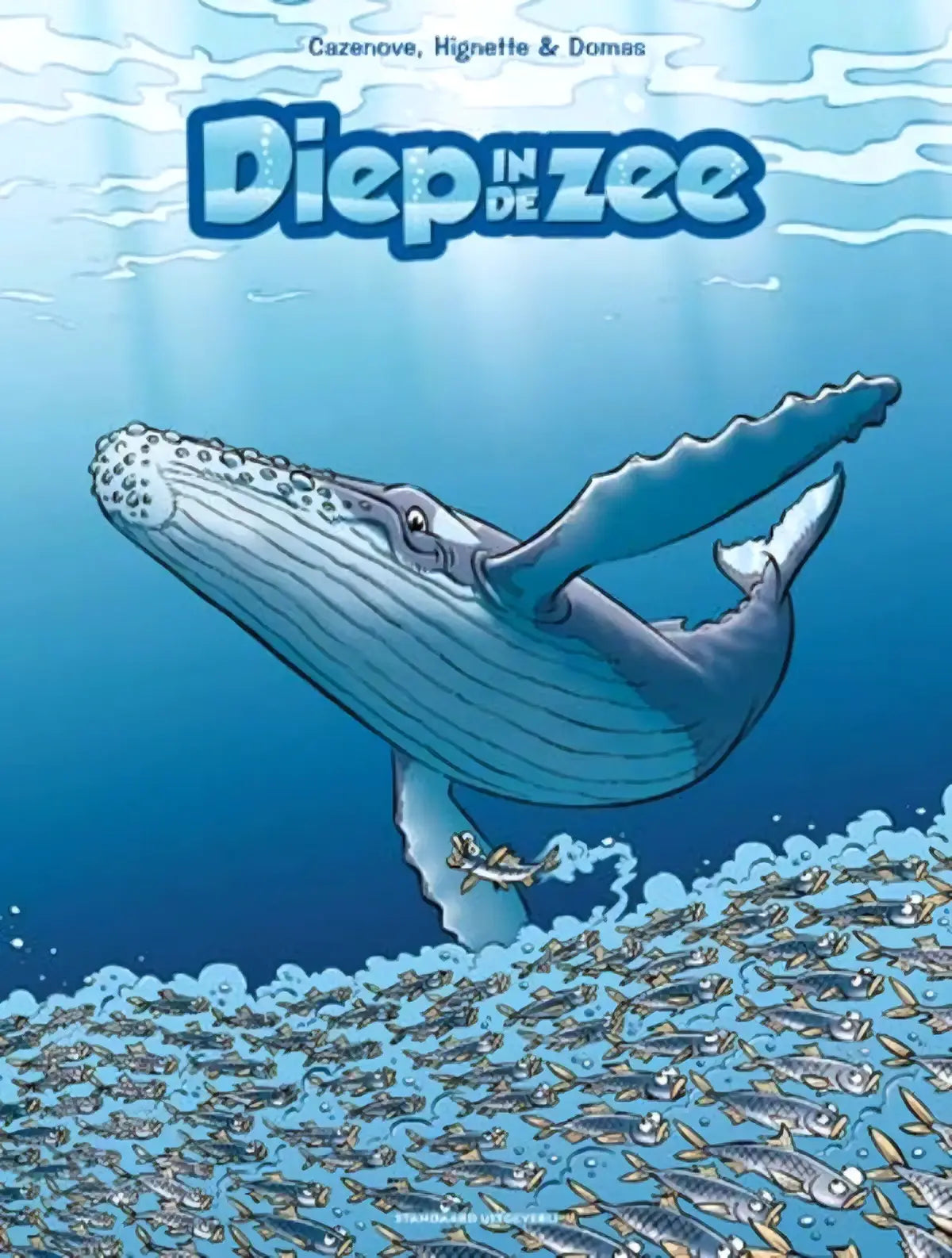 Cartoonillustratie van een blauwe vinvis met witte vlekken en glimlachend gezicht in diep in de zee deel 8 van christophe cazenove strips algemeen
