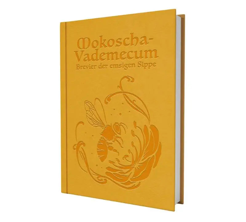 Een mosterdgeel hardcover boek met vergulde reliëfletters en een gedetailleerde afbeelding van een bij op de omslag mokoscha vademecum