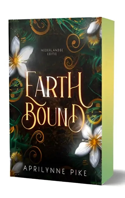 Het boek earthbound van aprilynne pike met een donkere groene omslag en gouden letters uit de earthbound-serie deel nederlandse ya fantasy