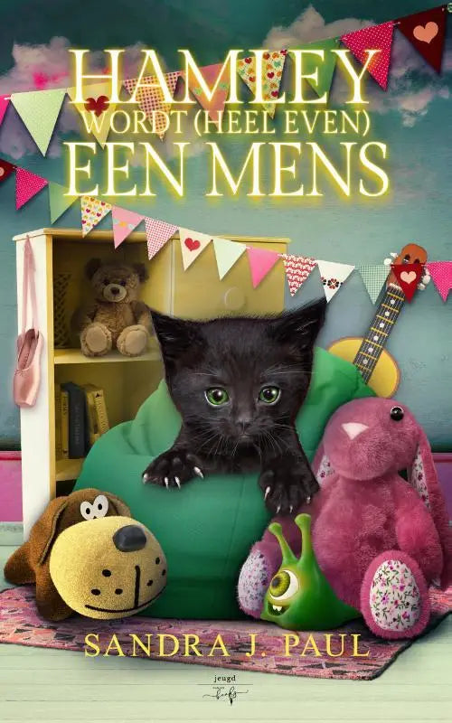 Hamley wordt heel even een mens met een zwarte kitten op een groene zachte zitzak en feestelijke versiering