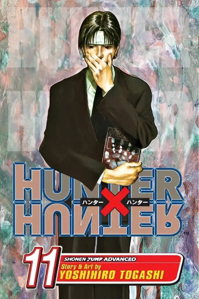 Hunter x hunter vol 11 next stop meteor city featuring black suit jacket white shirt and black tie held in hand