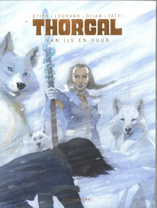 Cover van thorgal stripboek van ijs en vuur met vrouw in blauw harnas en staf omringd door witte wolven in sneeuw