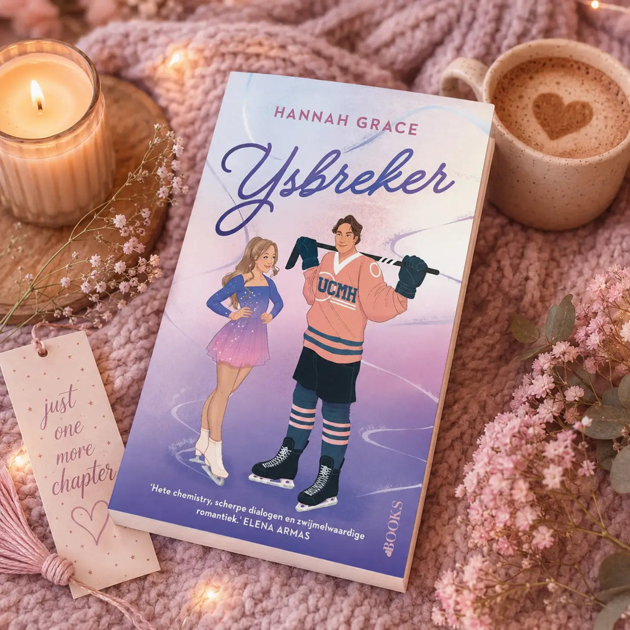 A soft pink and purple illustrated paperback book titled ijsbreker by hannah grace featuring a hockey player in an orange jersey