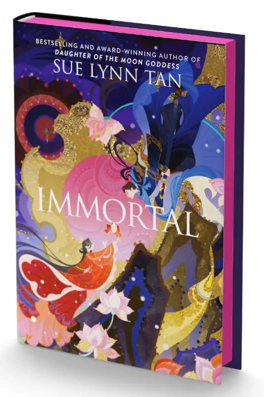 Een levendige hardcover boek getiteld immortal van sue lynn tan met een deluxe limited edition fantasie cover in blauw goud en roze