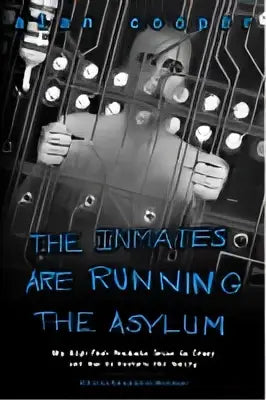 De boekcover toont titel the inmates are running the asylum in gedistressed blauwe letters voor een technologieboek
