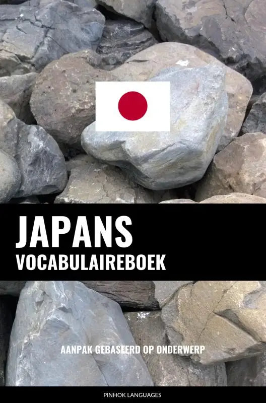 Witte rechthoekige japanse vlag met rode cirkel op grijze steen bij japans vocabulaireboek aanpak gebaseerd