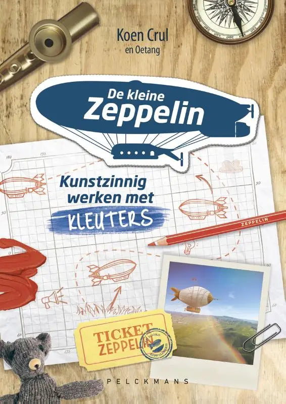 Blauwe en witte kleine zeppelin sticker met cartoonluchtballon ontwerp van koen crul pelckmans uitgevers