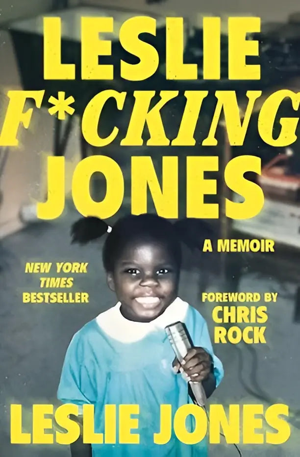 A vibrant yellow cover of the celebrity memoir leslie f*cking jones featuring a smiling girl with a microphone, new york times bestseller
