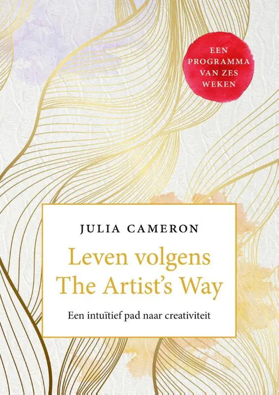 Lezen volgens the artist’s way een boek met een elegant crèmekleurig omslag en goudkleurige bladeren als intuïtief pad
