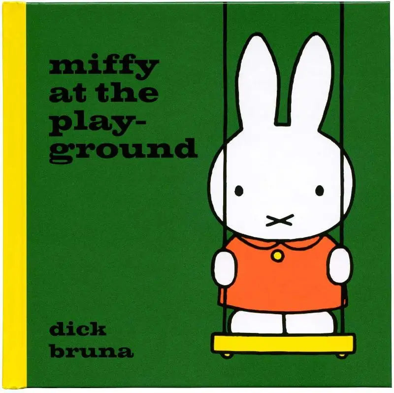 Groen kinderboek miffy at the playground met gele rug en miffy in oranje jurk op een schommel op de omslag