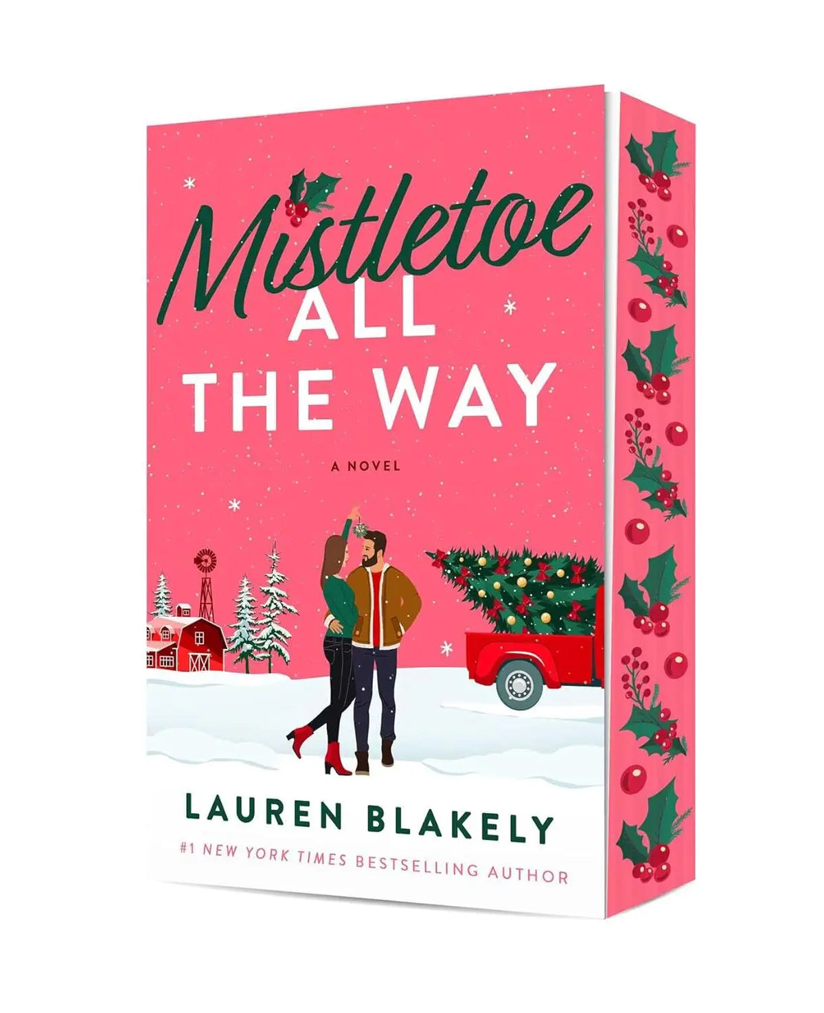 Roze hardcover roman mistletoe all the way van lauren blakely met feestelijke artwork van koppel onder maretak en kersttruck