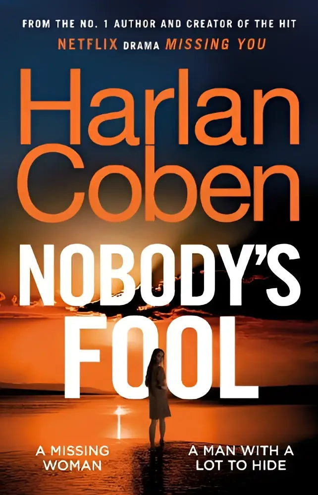 De boekcover van nobody’s fool door harlan coben toont oranje en witte letters tegen een zonsondergang met een figuur in water