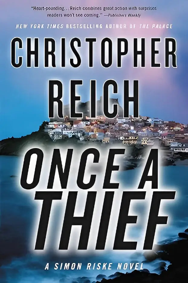 De boekcover van once a thief door christopher reich toont een kuststad bij schemering met vet zwarte letters