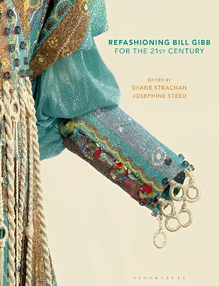 A turquoise beaded and fringed sleeve with metallic rings and intricate embroidery in refashioning bill gibb for the 21st century