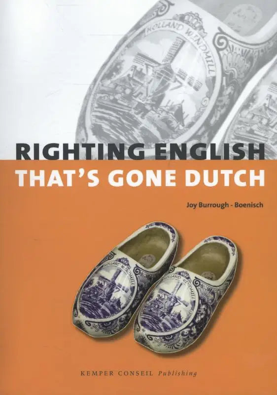 A pair of traditional dutch wooden clogs with blue and white windmill designs featured in righting english thats gone dutch by joy burrough-boenisch