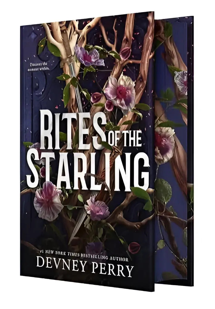 Limited edition the starling boek van devney perry met donkerblauwe cover en roze bloemenillustraties