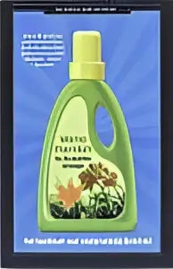 Groene plastic fles wasmiddel met gele dop en bloemmotief etiket in product de rockefeller-strategie met verne harnish management algemeen