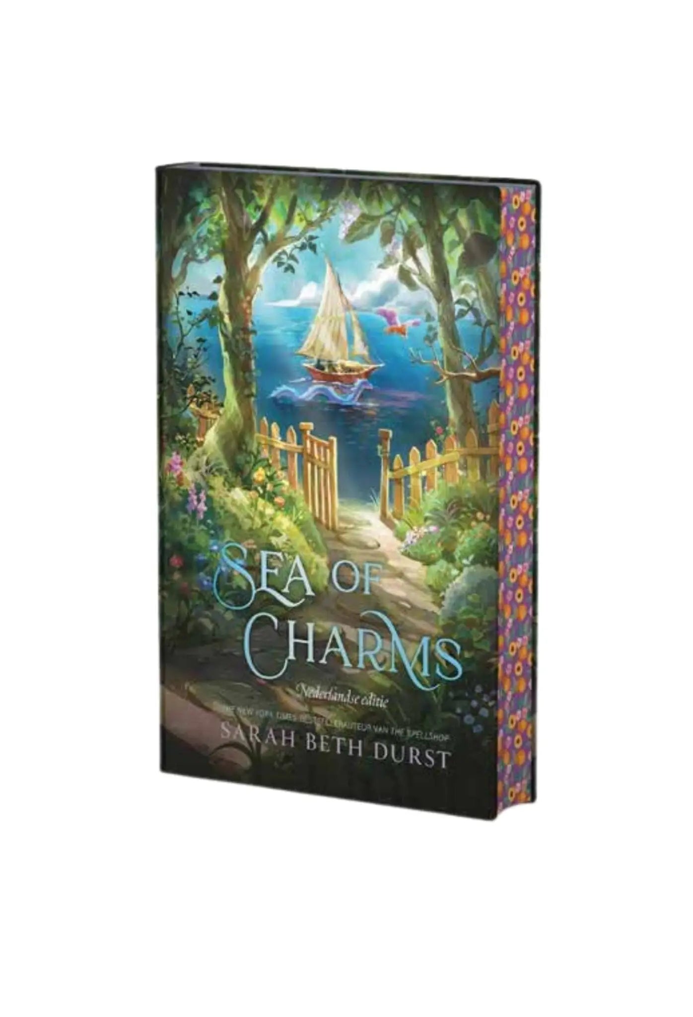 Hardcover book sea of charms by sarah beth durst with vibrant sailboat cover in cozy romantasy the spellshop setting