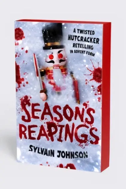 Boekcover van season’s reapings van sylvain johnson met rode en witte kleuren en een houten notenkraker in sneeuw
