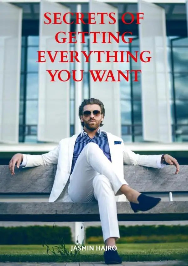 Een man in een wit pak en zonnebril zit op een bank in het boek secrets of getting everything you want