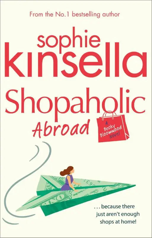 Rode papieren boodschappentas met zwarte cursieve tekst a becky bloomwood novel voor shopaholic abroad van sophie kinsella black swan