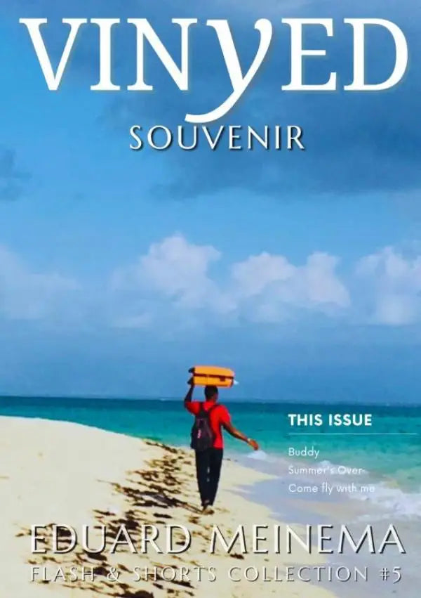 The cover of vinyed souvenir magazine shows a person in a red shirt walking on a beach carrying an orange suitcase