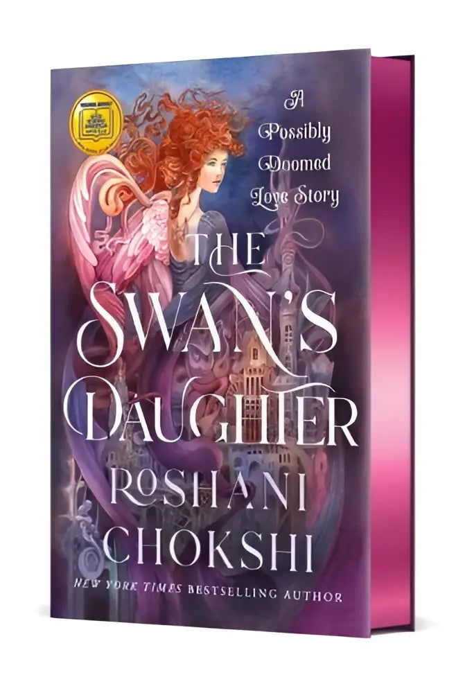 Hardcover boek the swans daughter van roshani chokshi met een rode haarkleurige vrouw in vloeiende gewaden en mogelijk gedoemd liefdesthema