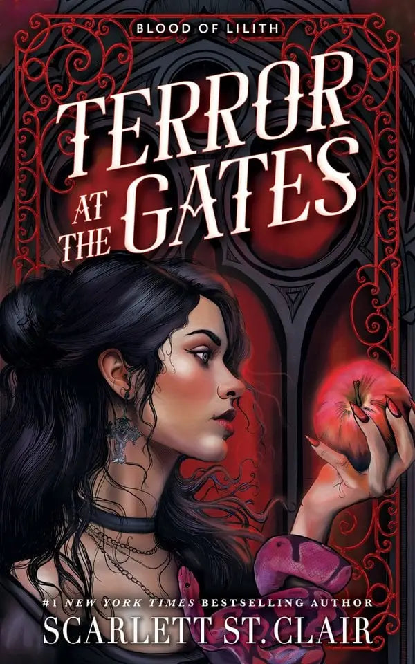 Red apple with glossy skin held in hand against dark hair and gothic background in terror at the gates standard edition
