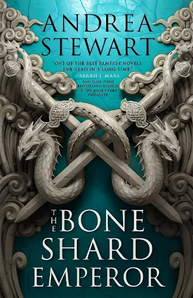 The bone shard emperor book cover features intricate dragon sculptures in weathered stone on a deep teal background the second book in the sunday times bestselling drowning empire series