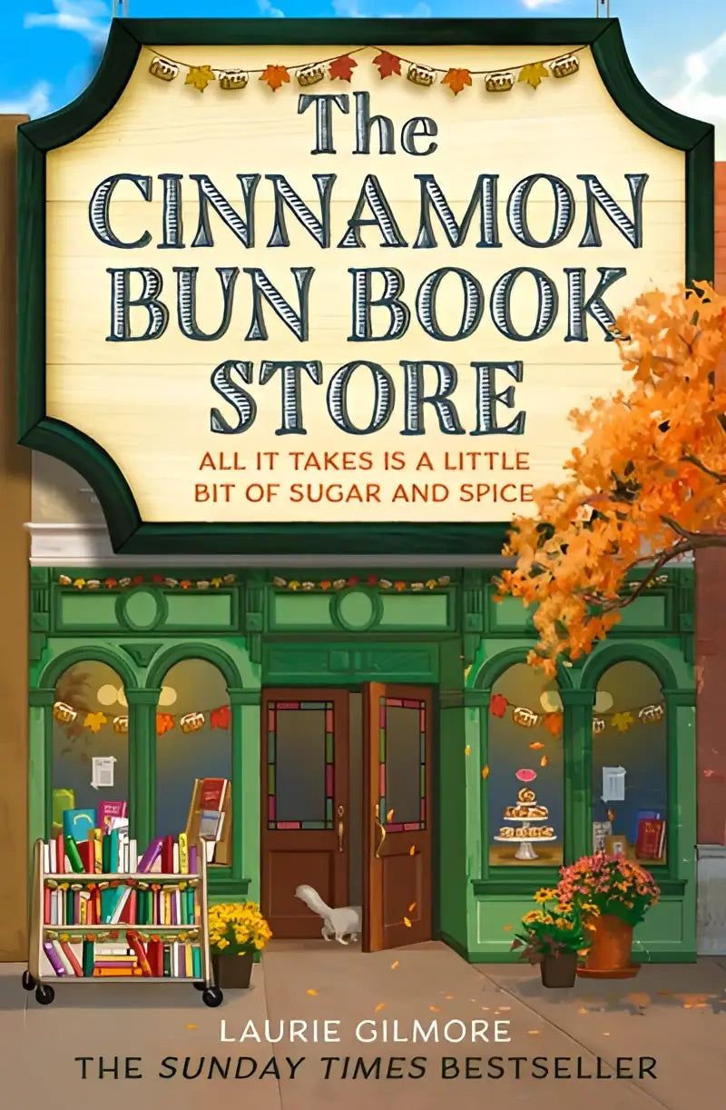 The charmingly illustrated cover of the cinnamon bun book store by laurie gilmore with a cozy green storefront
