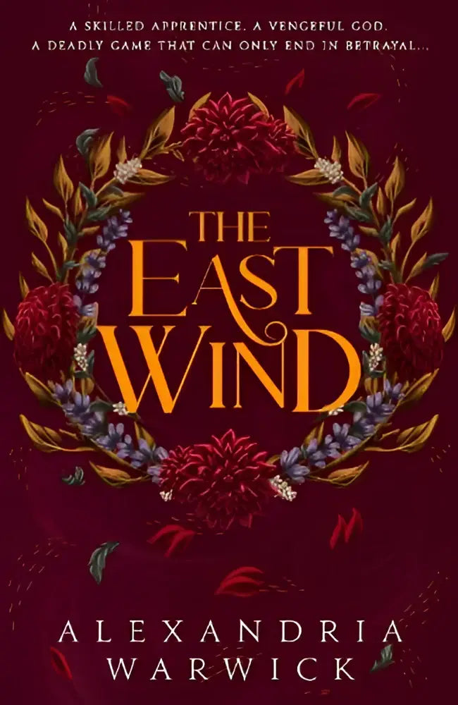 De cover van het boek the east wind van alexandria warwick met rijke gouden letters en levendige bloemenkransen