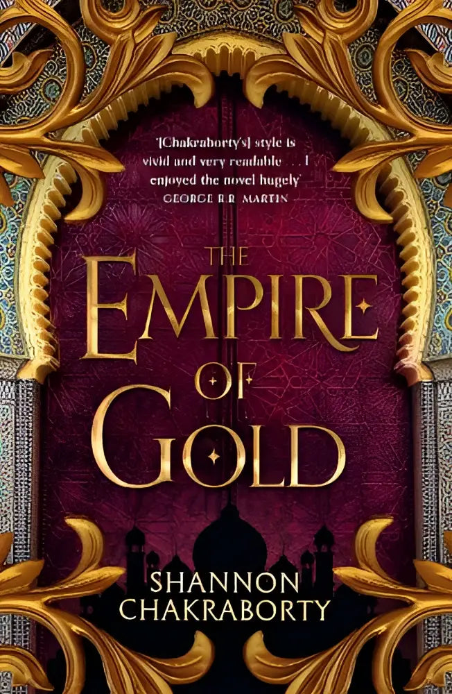 De empire of gold boekomslag met maroon achtergrond en gouden sierlijke filigranen en de titel in goud
