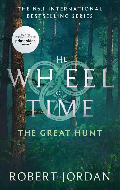 The great hunt book cover with misty forest, purple flowers, and teal-green sky from the wheel, now a major tv series