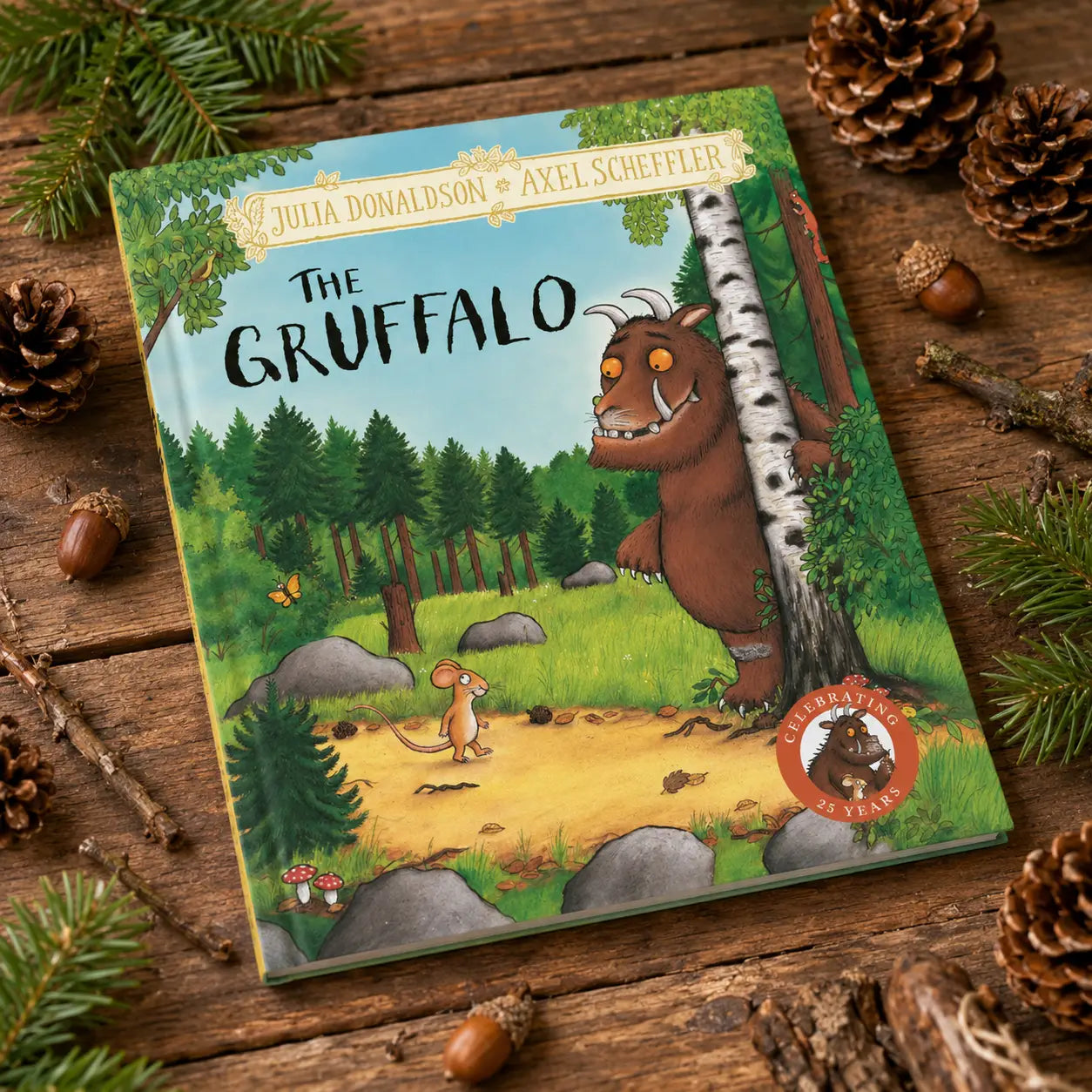 Hardback children’s book the gruffalo by julia donaldson and axel scheffler with colorful illustration of brown gruffalo