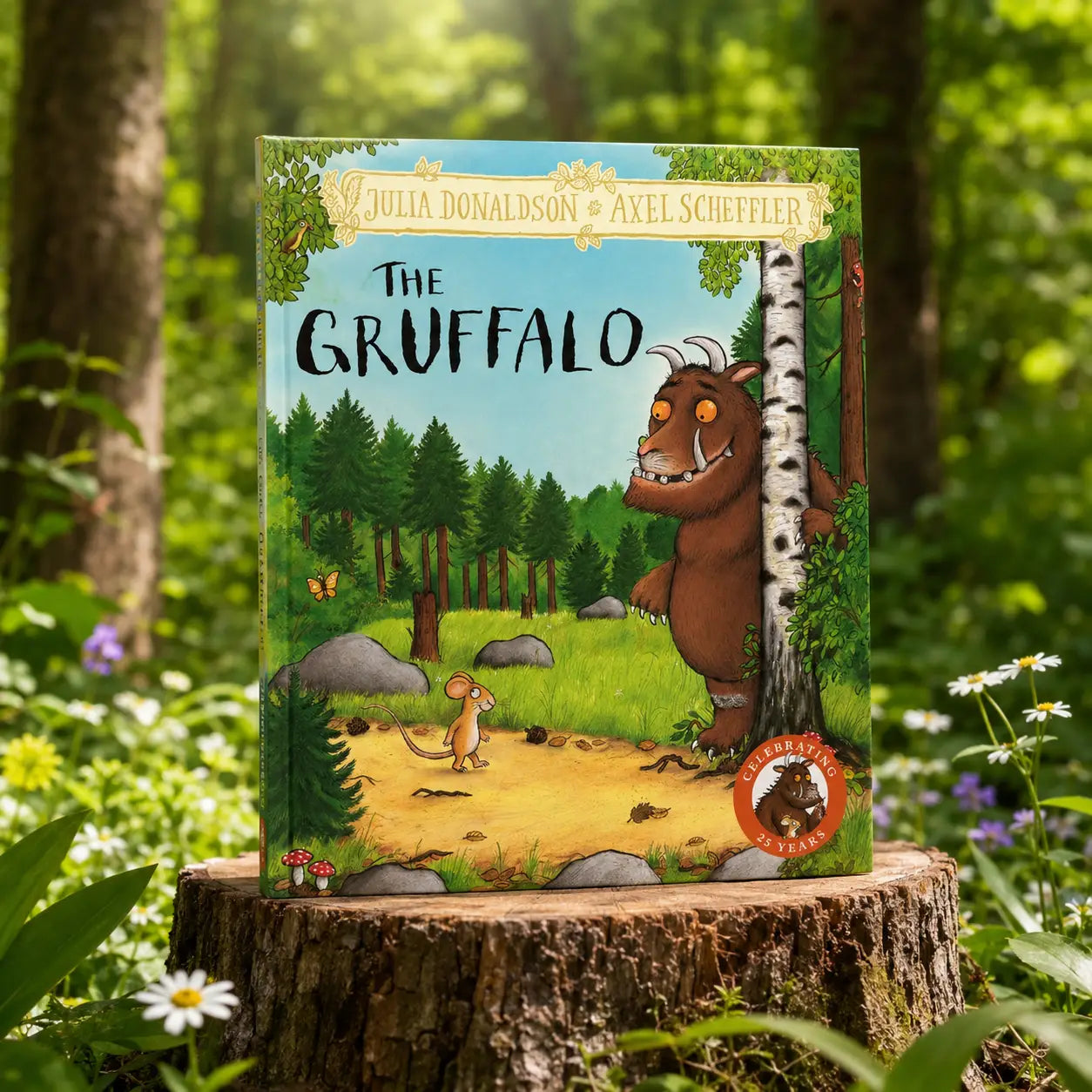 The gruffalo hardback gift edition by julia donaldson and axel scheffler showing a brown creature peeking behind a birch tree