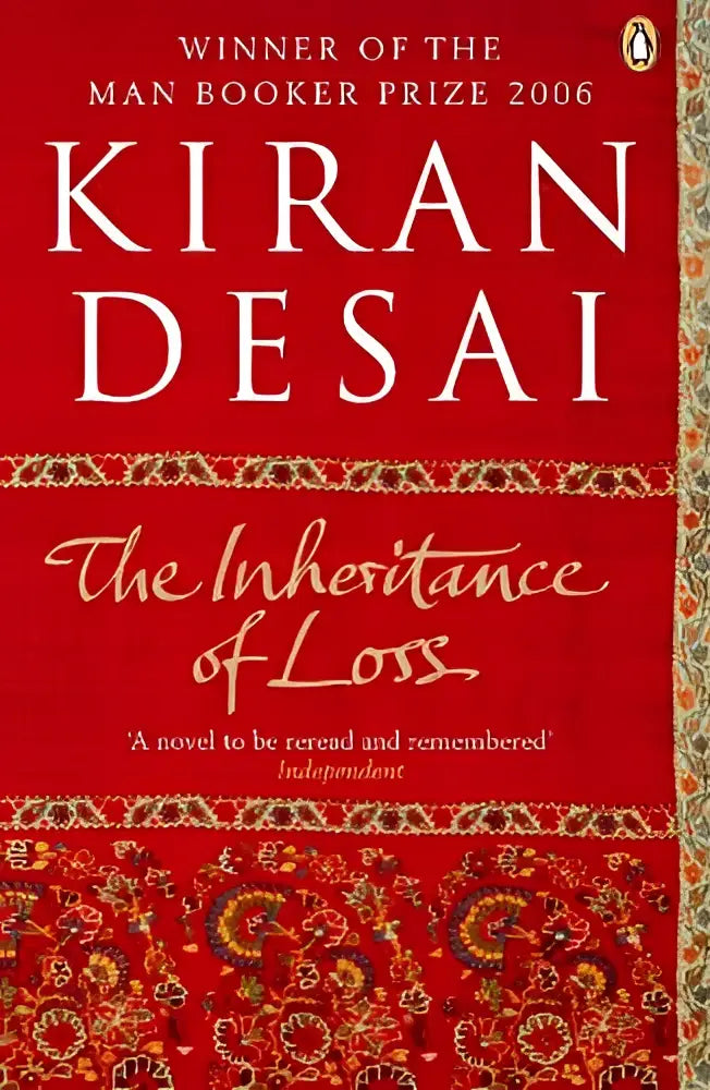 Rode hardcover boek the inheritance of loss van kiran desai met gouden en blauwe patronen, bekend from booker prize