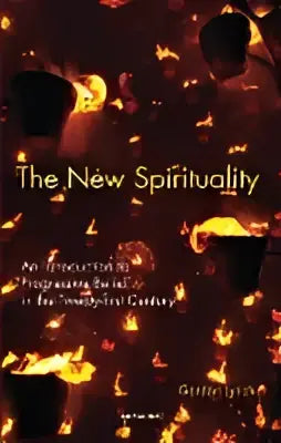 Boek the new spirituality met donker omslag en gloeiende oranje en gele abstracte ontwerpen over moderne spiritualiteit