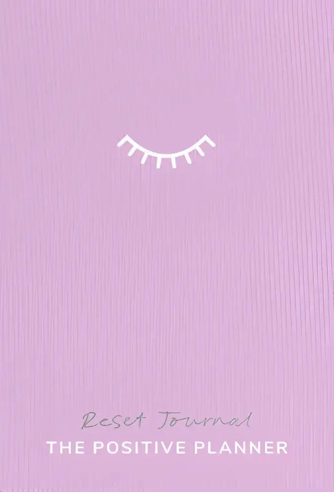 A soft lavender positive planner cover with a minimalist white eyelash design titled reset journal the positive planner