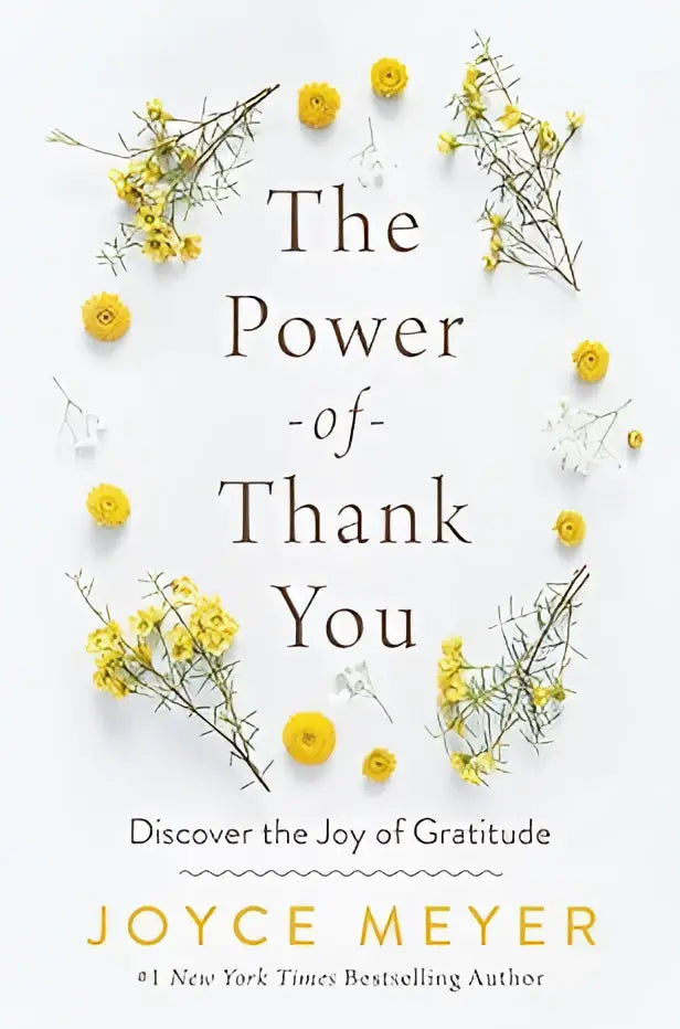 De boekomslag van The power of thank you toont de titel in zwarte serifletter met gele en witte bloemen