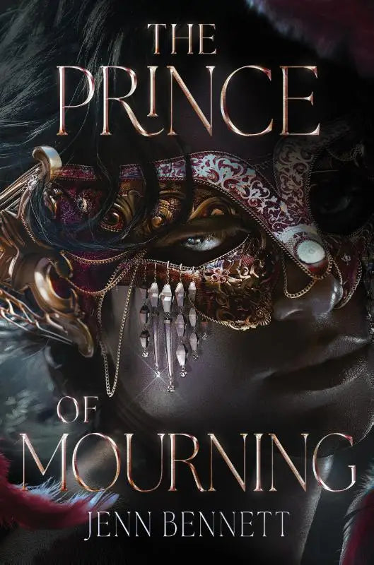 An ornate dark red and gold venetian mask the prince with intricate filigree and dangling crystal beads