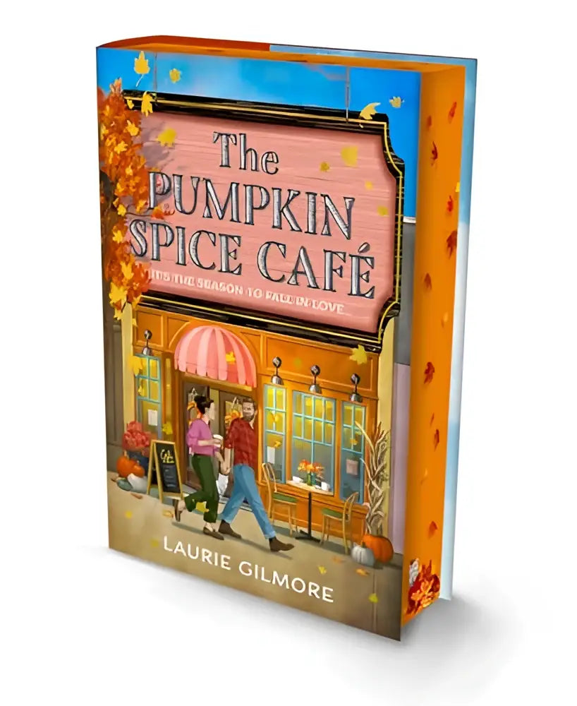 The pumpkin spice café deluxe edition part 1 features a vibrant autumn cover with a café and decorative fall leaves